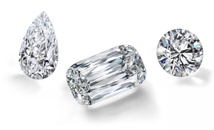 loose pear shaped diamond emerald shaped diamond and round diamond